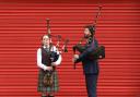 Piper Emma Hill and piper, composer and teacher John Mulhearn at the launch of Piping Live! and World Pipe Band Championships 2024 in the Barras