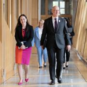 First Minister of Scotland John Swinney and Deputy First Minister Kate Forbes arrive at the Scottish Parliament