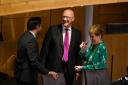 Five, six, seven: John Swinney chats to predecessors Humza Yousaf and Nicola Sturgeon ahead of the vote for FM in Holyrood
