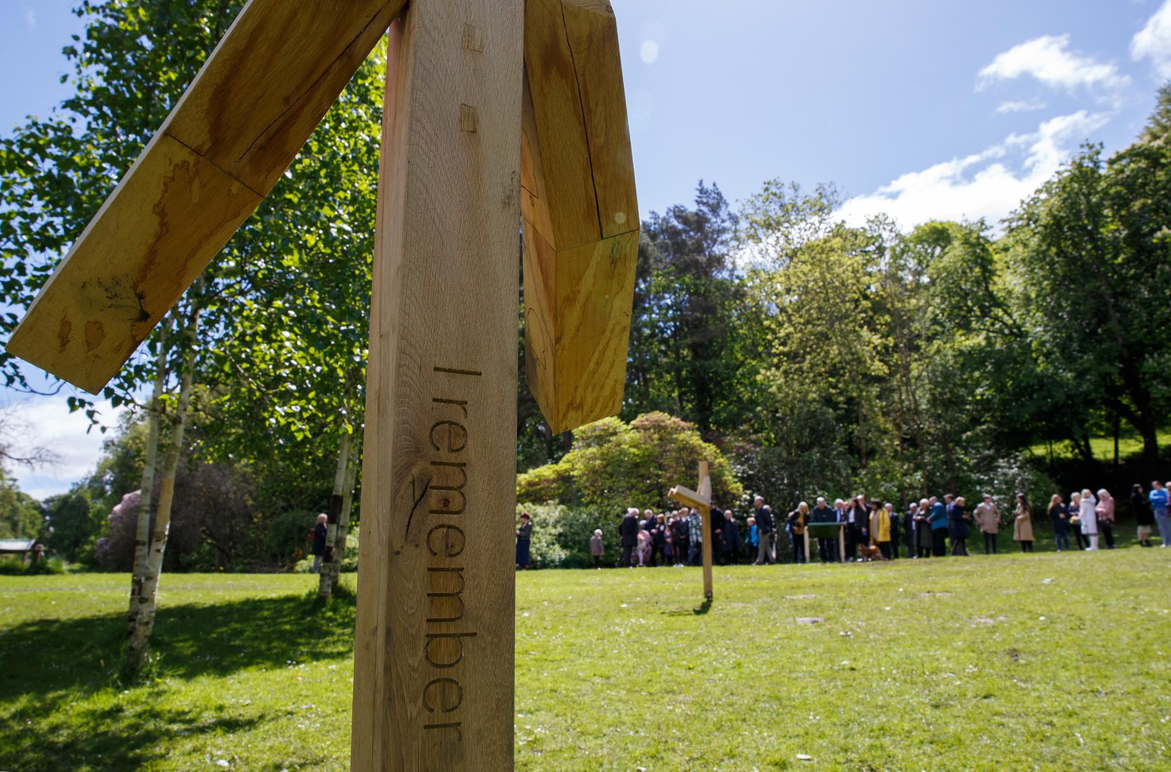 Opening of The Herald I Remember national Covid memorial. People pictured at Birch Grove in Pollok Country Park. Birch Grove is one of the areas in the park where artist Alec Finlay has installed supports as part of the I Remember memorial. Photograph by