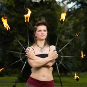 Iga Sobieraj now teaches the skill of fire spinning in Edinburgh meadows.