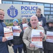 GMB General Secretary Gary Smith, left, with organiser John Slaven, right, and workers in Glasgow friday to urge action to resolve issues facing cleaners, caterers security and housekeeping staff employed by Police Scotland contractor Atalian Servest