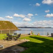 This remarkable four bedroomed modern house in North Queensferry occupies a setting surrounded on two sides by the Firth of Forth