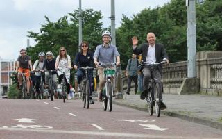 Green minister Patrick Harvie cycles with others on the opening of the South City Way