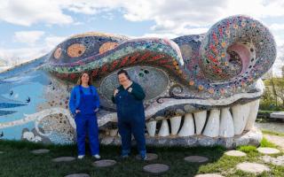 Ruth Impey, left, and Louise Nolan with Bella The Beithir, a 125-metre concrete serpent designed by artist Nichol Wheatley