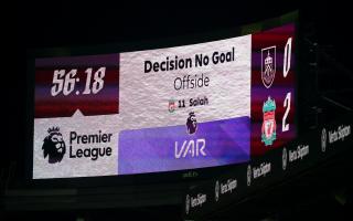 A VAR decision is displayed at Anfield