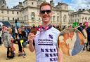 Callum Davidson, 26, with his London Marathon medal after running for Crosshouse Children's Fund and, inset, Callum and Andrew at birth