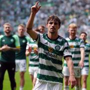 Matt O'Riley celebrates Celtic's win over Rangers with his team mates at Parkhead today