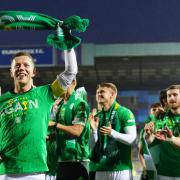Celtic captain Callum McGregor celebrates with his team mates at Rugby Park last night after the Parkhead club had clinched the Scottish title