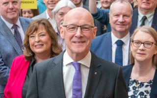 SNP MSP John Swinney with supporters on Thursday as he announced his bid for the SNP leadership