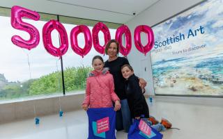 Victoria Leckie along with Ella, 8, and William, 7, were welcomed as the 500,000th visitors to the new Scottish galleries