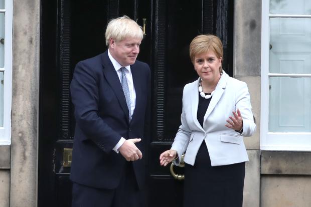 First Minister Nicola Sturgeon welcomes Prime Minister Boris Johnson outside Bute House in Edinburgh ahead of their meeting in 2019