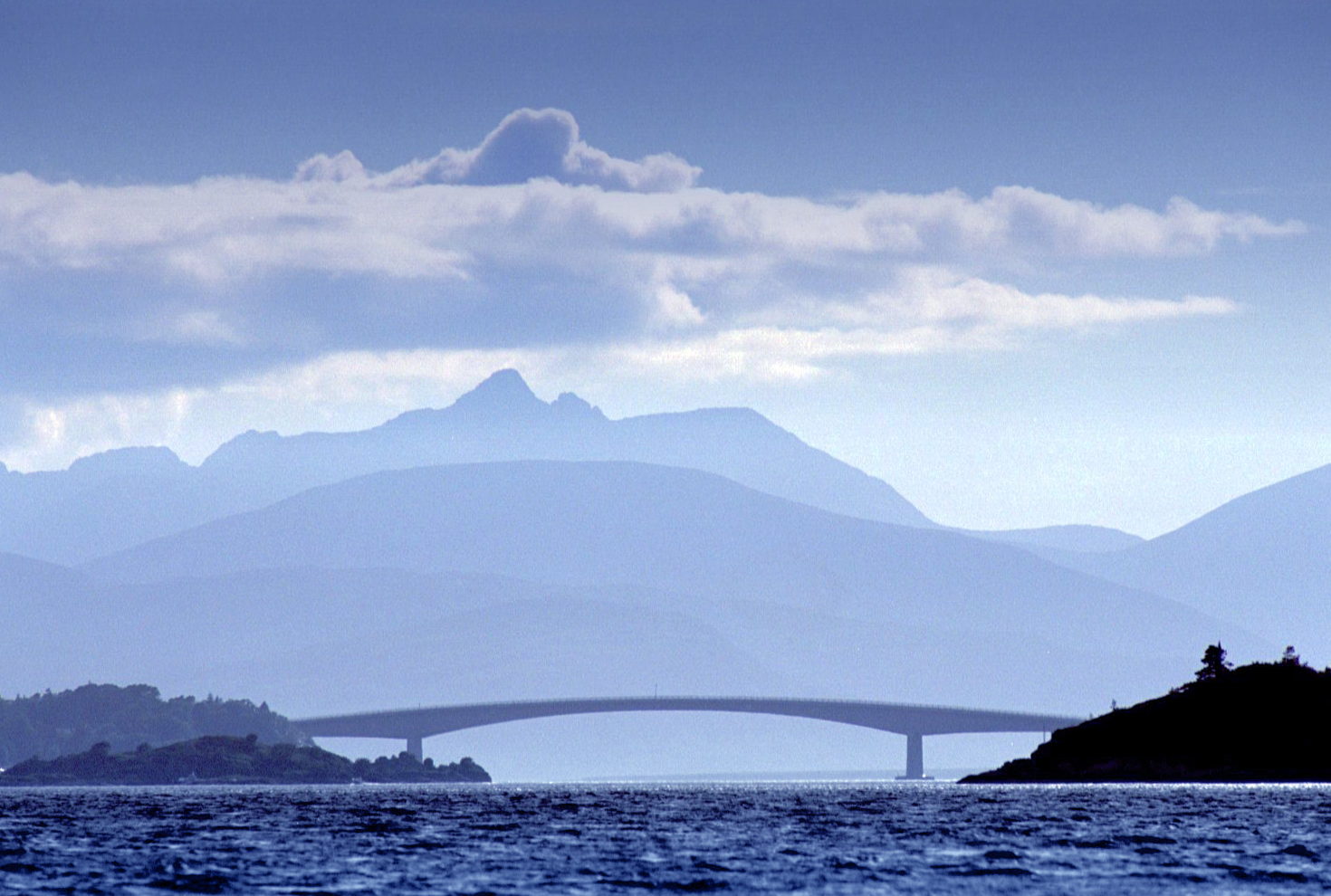 The Skye road bridge with the Cuillin mountain range on the Isle of Skye in the background. Scotland will be among the top spring and summer breaks.