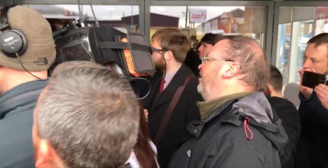 A video posted online shows Rev Cameron, centre, shouting at the Labour leader outside a campaign event