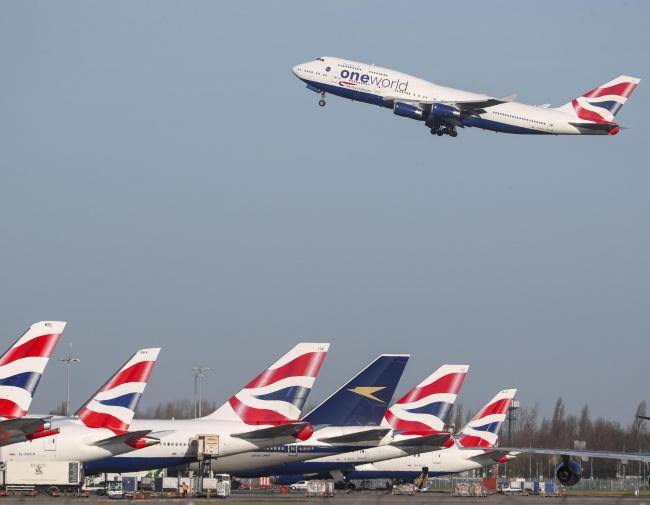 A British Airways plane takes off at Heathrow Airport