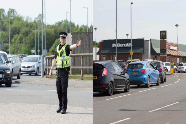 Police step in to control traffic jams outside reopened McDonald's after coronavirus lockdown rule relaxation