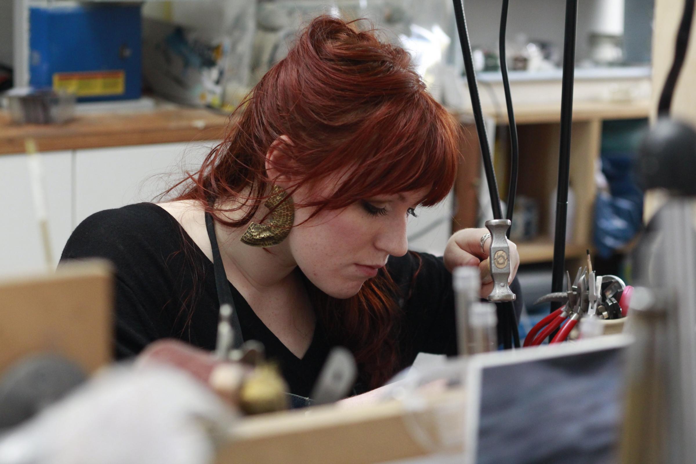 Caitlin Hegney at work in her studio. The jeweller donated more than £400 to the memorial fund.