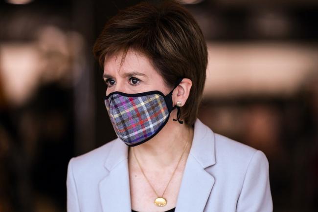 The First Minister sported a tartan face mask during a visit to Fort Kinnaird in Edinburgh