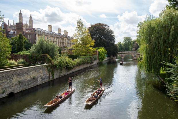 People pass Clare College as they punt along the River Cam in Cambridge. PA Photo. Picture date: Friday September 4, 2020. Photo credit should read: Joe Giddens/PA Wire.