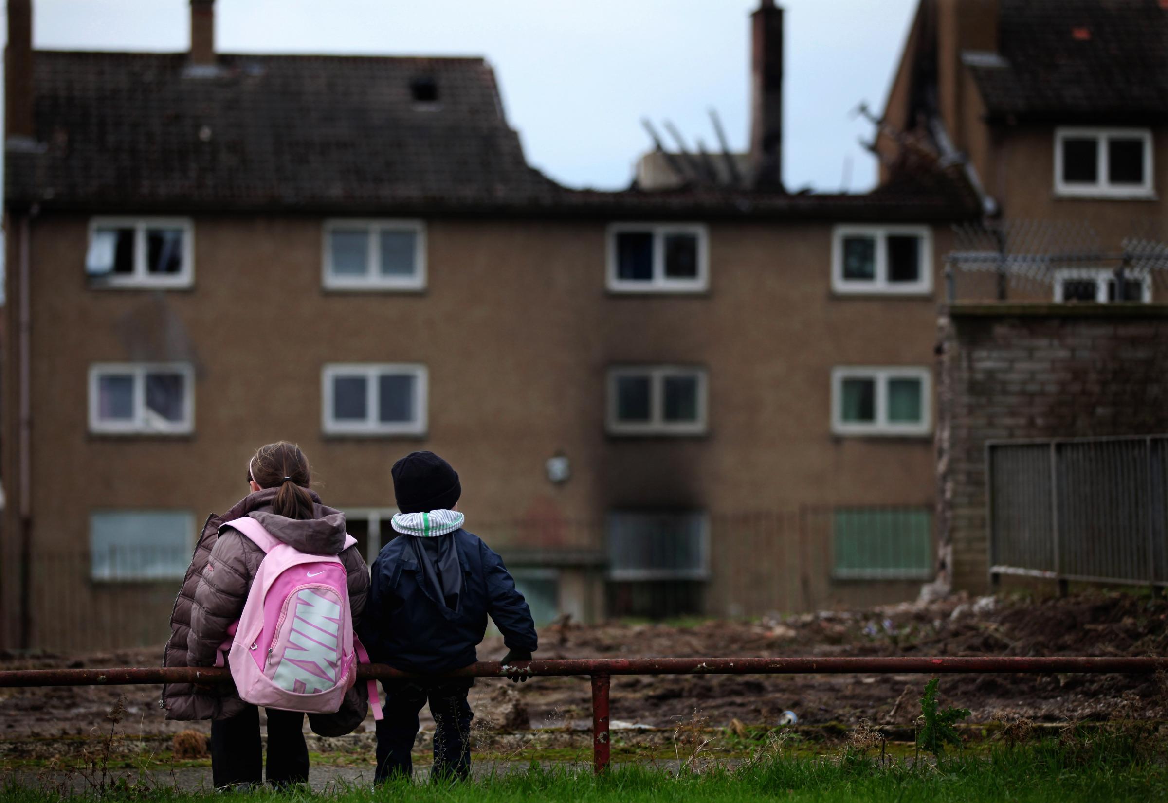 GLASGOW, SCOTLAND - NOVEMBER 18: Children make their way home from school in the Easterhouse housing estate on November 18, 2010 in Glasgow, Scotland. Thousands of homes in the poorest parts of the UK that were set for demolition may be left with people