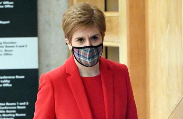 HeraldScotland: First Minister Nicola Sturgeon arriving to give an update on Covid restrictions in the Scottish Parliament, Edinburgh. PA Photo. Picture date: Tuesday December 8, 2020. See PA story SCOTLAND Coronavirus. Photo credit should read: Andy Buchanan/PA Wire