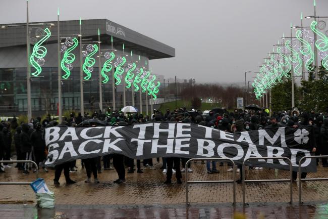 GLASGOW, SCOTLAND - DECEMBER 13: Celtic fans protest holding up a banner outside the stadium prior to the Ladbrokes Scottish Premiership match between Celtic and Kilmarnock at Celtic Park on December 13, 2020 in Glasgow, Scotland. The match will be played