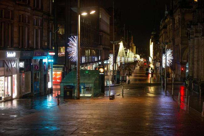 A quiet Buchanan Street in Glasgow on Hogmanay evening. Picture: Colin Mearns