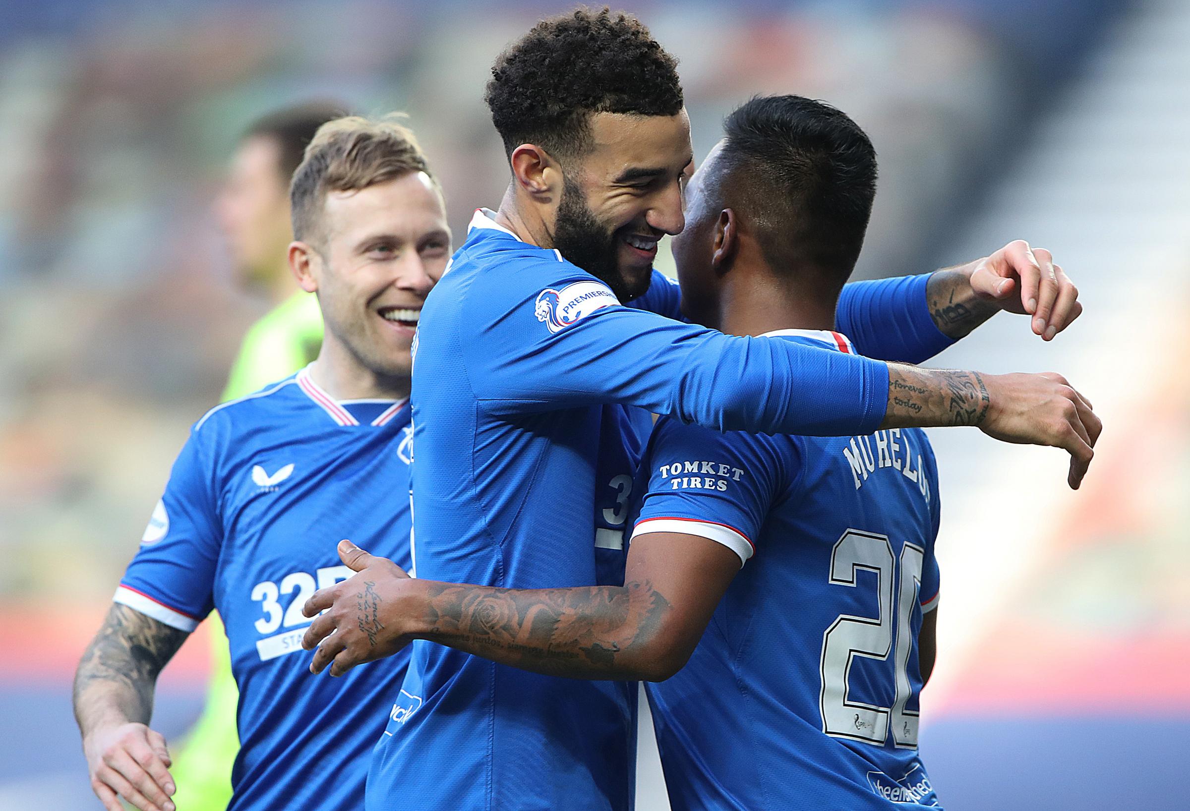 Alfredo Morelos of Rangers is congratulated by Connor Goldson of Rangers after scoring his sides fourth goal during the Ladbrokes Scottish Premier League match between Rangers and Dundee United