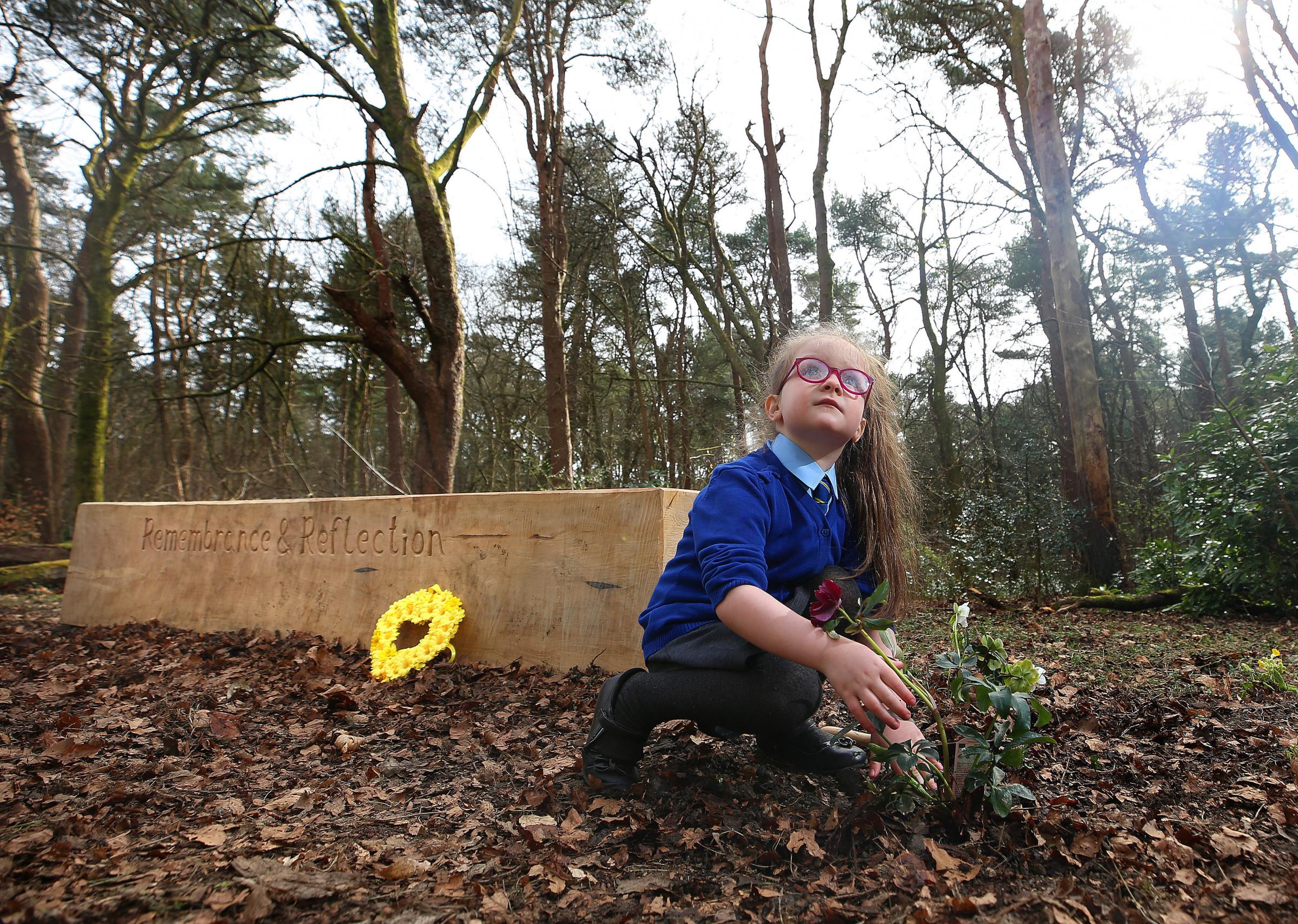 Jessica (5) daughter of Connie McCready plants a flower after a plaque was unvieled by Lord Provost of Glasgow Philip Braat in Pollok Park to mark the opening of the Garden of Remembrance. STY . Pic Gordon Terris/ Herald&Times.22/3/21 ...