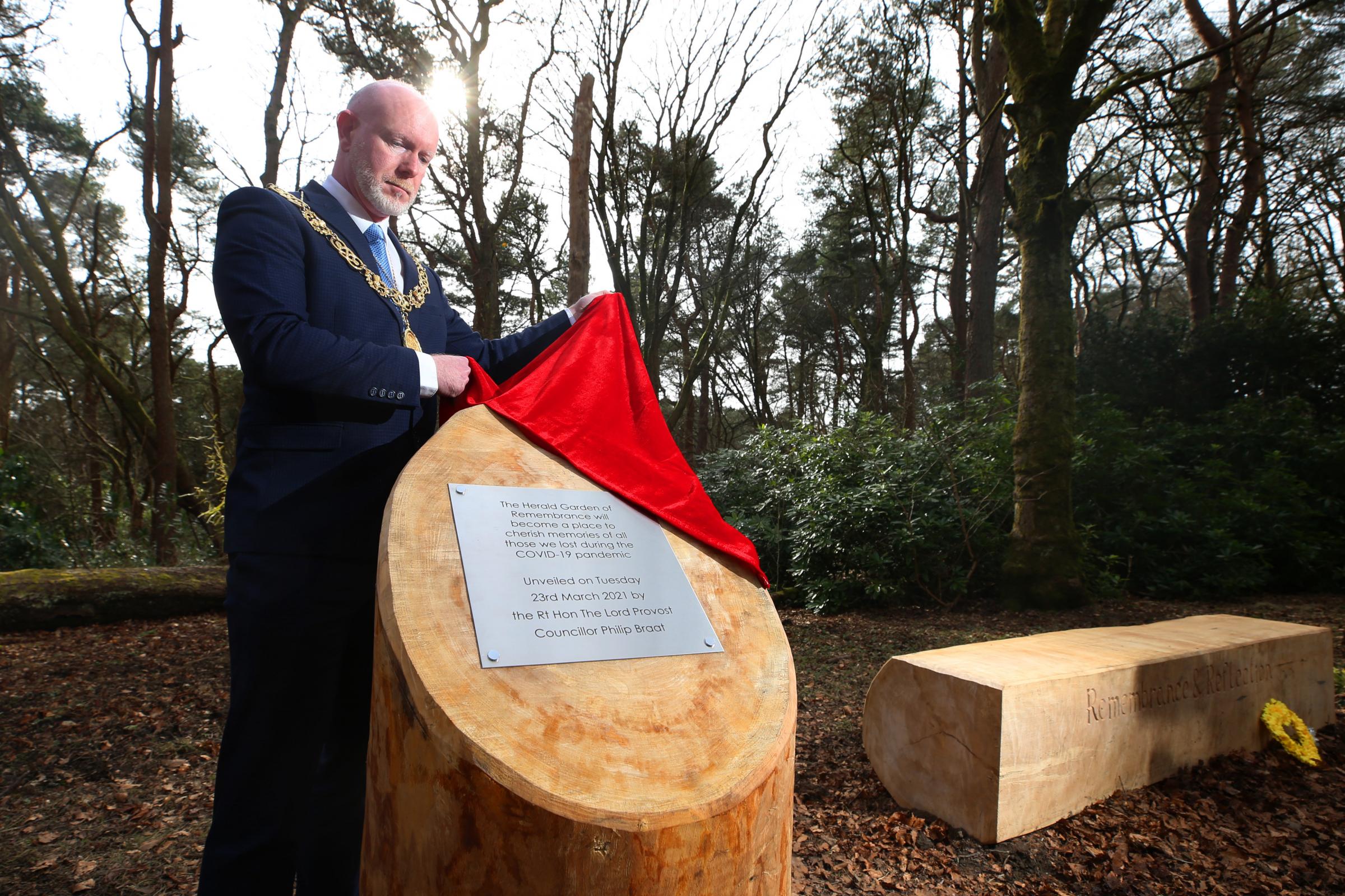 The plaque is unveiled by Lord Provost of Glasgow Philip Braat to mark the site reveal for the memorial garden
