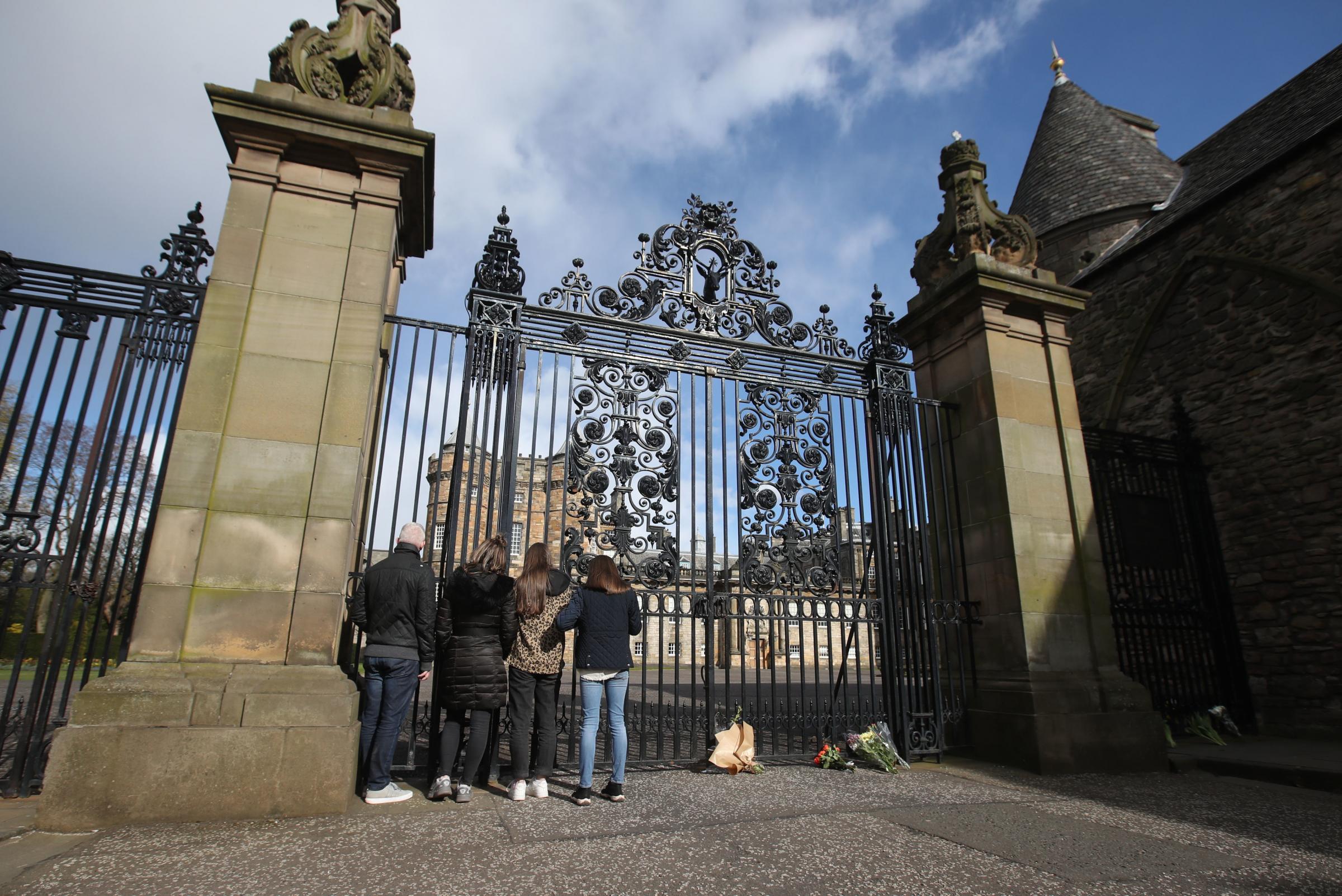 People at the gates of the Palace of Holyroodhouse in Edinburgh after the announcement of the death of the Duke of Edinburgh. 