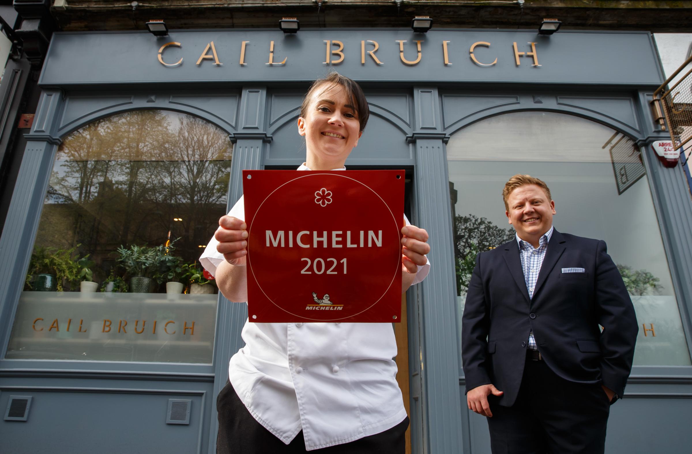 Cail Bruich head chef Lorna McNee pictured holding the Michelin star plaque that the restaurant with general manager Chris Donnachie. 