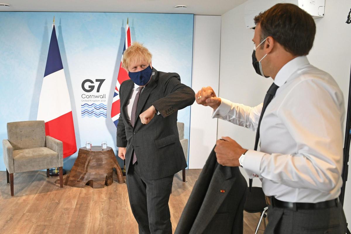 Boris Johnson greets French President Emmanuel Macron at the G7 summit