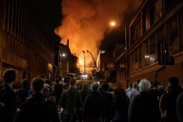 HeraldScotland: Crowds looked on as firefighters battled the 2018 blaze