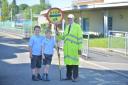 Lollipop man Alec McGunnigle, is retiring this summer after 27 years of service at the age of 85. He is photographed here at Merrylee Primary School with pupils Ben 8 (left) and Daniel 9Kirsty Anderson Newsquest