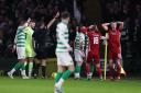 Aberdeen's Sam Cosgrove (right) is sent off during the Ladbrokes Scottish Premiership match at Celtic Park, Glasgow. PA Photo. Picture date: Saturday December 21, 2019. See PA story SOCCER Celtic. Photo credit should read: Andrew Milligan/PA Wire. RE