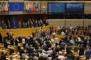 MEPs of the European Parliament, some holding hands, rise to sing 'Auld Lang Syne' following a historic vote on the Brexit agreement at a session of the European Parliament on 29 January paving the way for the UK's exit from the EU.