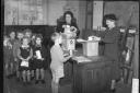School children getting their powdered milk rations