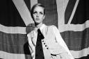 British model Twiggy posing in front of  Union Jack flag, 1966, Twiggy in Mary Quant, 1966, from Mary Quant at Dundee V&A.