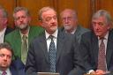 Robin Cook photographed making his resignation speech in the House of Commons in March 2003.. He is looked on by Jeremy Corbyn,  back left, and other Labour MPs. Photo PA.