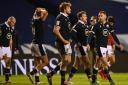 EDINBURGH, SCOTLAND - FEBRUARY 13: Finn Russell of Scotland (R) and teammates walk off the pitch following defeat during the Guinness Six Nations match between Scotland and Wales at Murrayfield on February 13, 2021 in Edinburgh, Scotland. Sporting