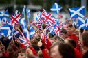 Scottish flags and Union flags are waved at the opening of the Borders Railway at Tweedbank Station on September 9, 2015 in Tweedbank, Scotland. Photo by Chris Jackson/Getty Images