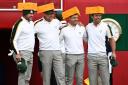 Team Europe's Lee Westwood, Ian Poulter, Rory McIlroy and Paul Casey (left-right) arrive on the first tee wearing Green Bay Packers Cheesehead hats during the third preview day of the 43rd Ryder Cup at Whistling Straits, Wisconsin. Credit: PA