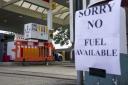 Petrol retailers warn pumps running dry because of panic-buying