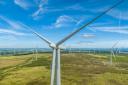 Electricity from wind farms like Whitelee near Glasgow will increasingly power the UK’s electricity network.