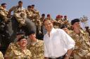 File photo dated 29/05/03 of Tony Blair meeting troops in the port of Umm Qasr. The former Prime Minister would like to be remembered for transforming Britain's schools and bringing peace to Northern Ireland, but for many his premiership was defined
