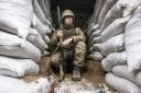A Ukrainian soldier in the trench on the line of separation from pro-Russian rebels, Mariupol, Donetsk region, Ukraine, Friday, Jan. 21, 2022. (AP Photo/Andriy Dubchak).