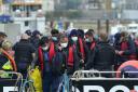 Migrants are brought ashore in Dover, Kent