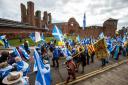 Independence supporters walk pas Arbroath Abbey