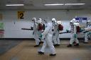Soldiers in protective suits disinfect a metro station following a surge of coronavirus disease (COVID-19) infections in Taipei, Taiwan May 20, 2021. REUTERS/Ann Wang.
